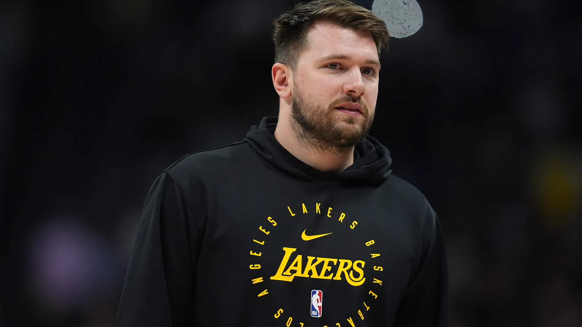 Los Angeles Lakers guard Luka Doncic walks on the court during a time out in the second half of an NBA basketball game against the Denver Nuggets, Friday, March 14, 2025, in Denver. (AP Photo/David Zalubowski)