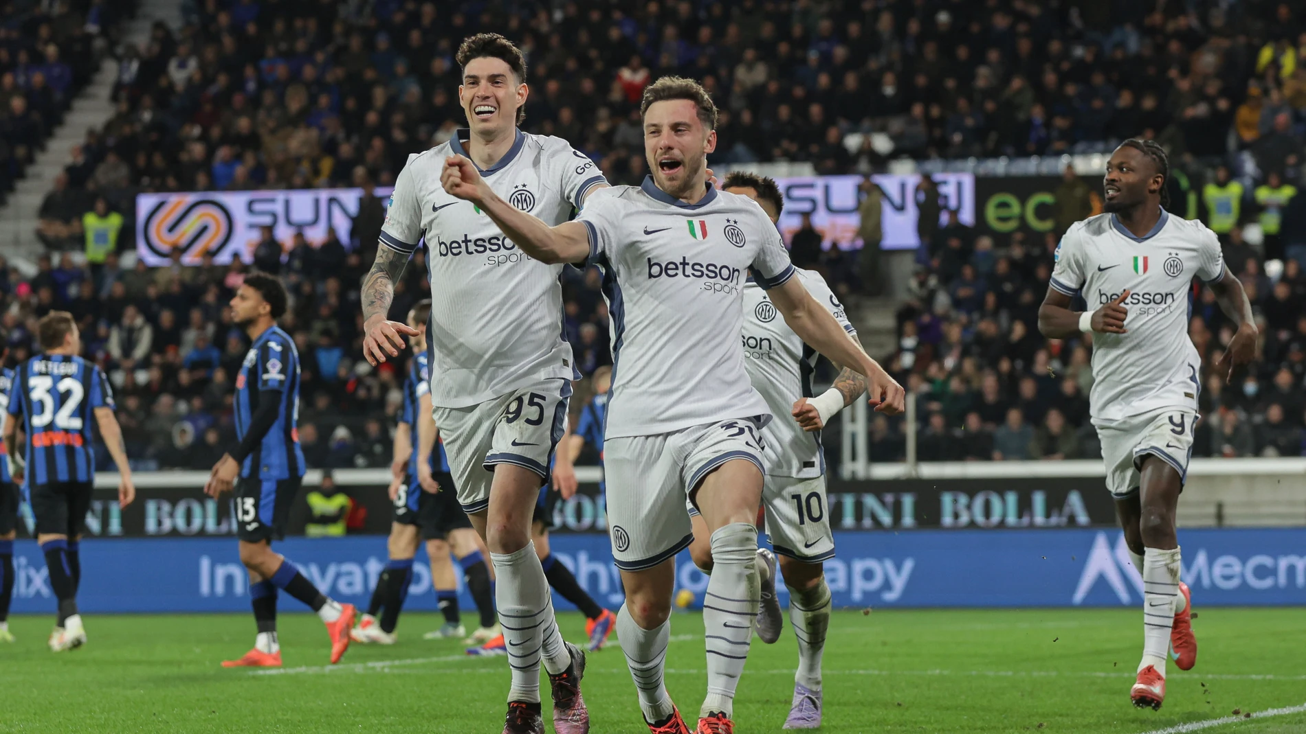 Inter Milan's Carlos Augusto celebrates after scoring during the Serie A soccer match between Atalanta and Inter at the Gewiss Stadium in Bergamo, Italy, Saturday, March 16, 2025. (Stefano Nicoli/LaPresse via AP)