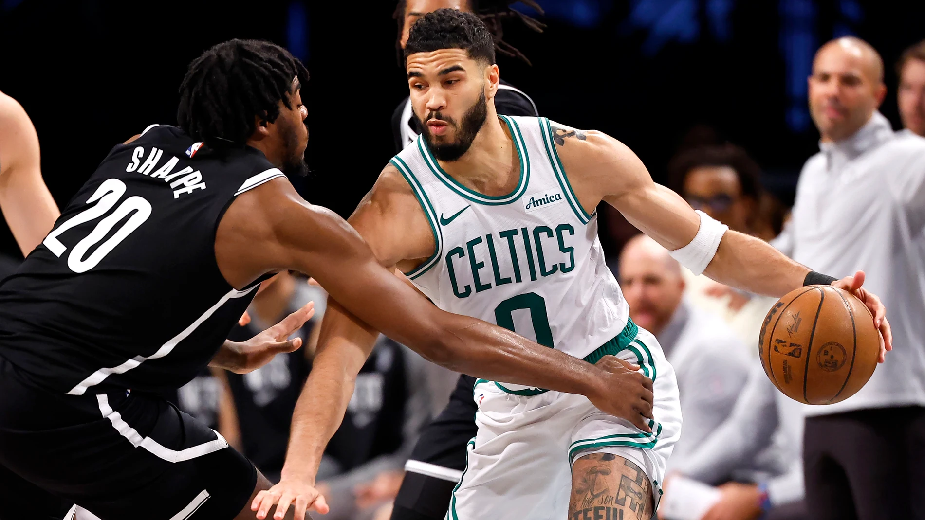 Boston Celtics forward Jayson Tatum (0) drives to the basket against Brooklyn Nets center Day'Ron Sharpe (20) during the second half of an NBA basketball game, Saturday, March 15, 2025, in New York. (AP Photo/Noah K. Murray)