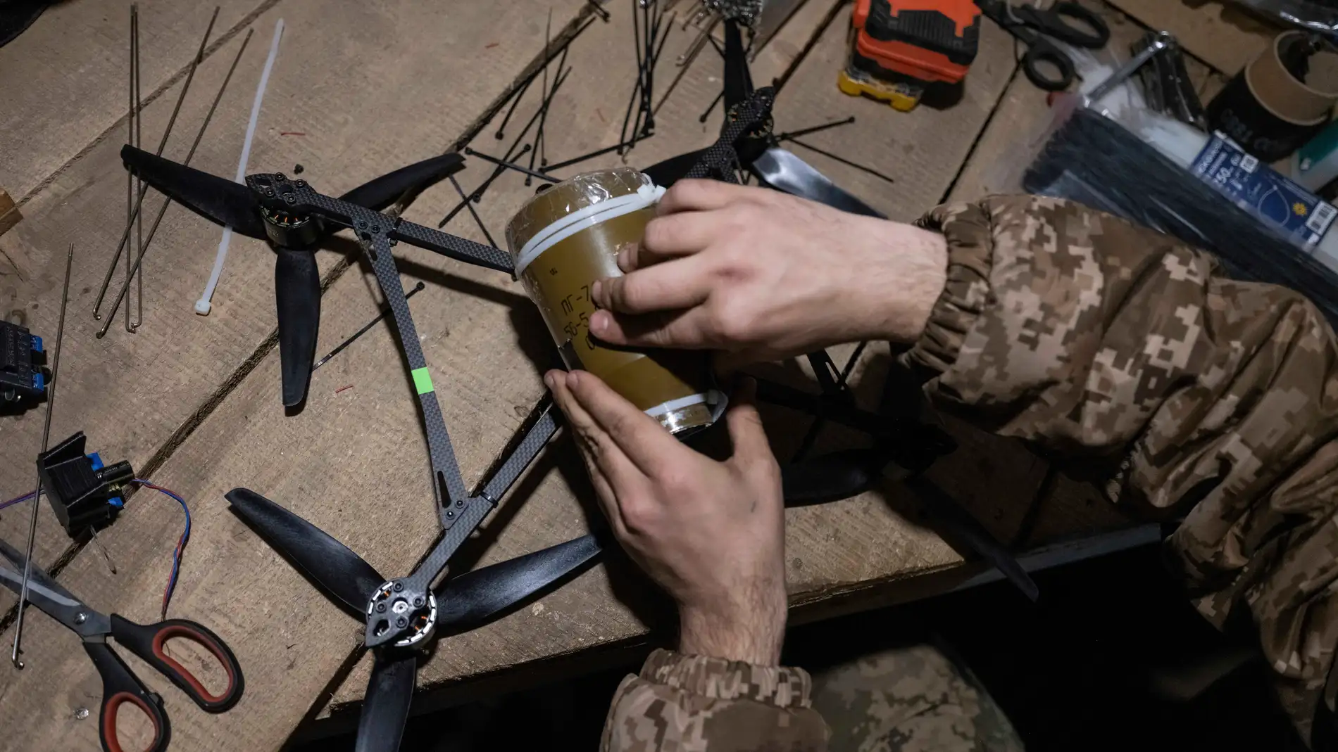 In this photo provided by Ukraine's 93rd Kholodnyi Yar Separate Mechanized Brigade press service, a soldier in a shelter gets ready to fire FPV drones towards Russian positions in a shelter in Kramatorsk direction, Donetsk region, Ukraine, Saturday, March 22, 2025. (Iryna Rybakova/Ukraine's 93rd Mechanized Brigade via AP)