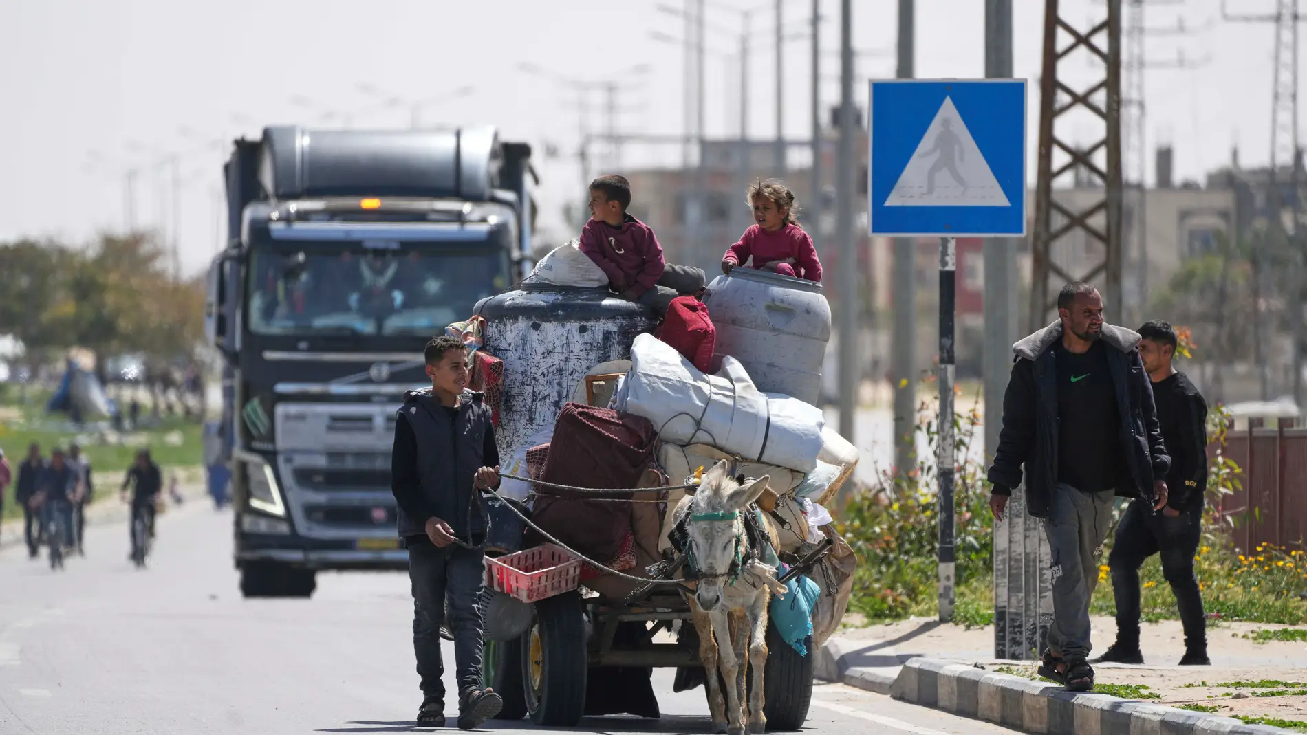 Displaced Palestinians, who flee from Rafah, arrive in Khan Younis, Gaza, on Monday, March 31, 2025, after the Israeli military issued sweeping evacuation orders covering most of Rafah. (AP Photo/Abdel Kareem Hana)