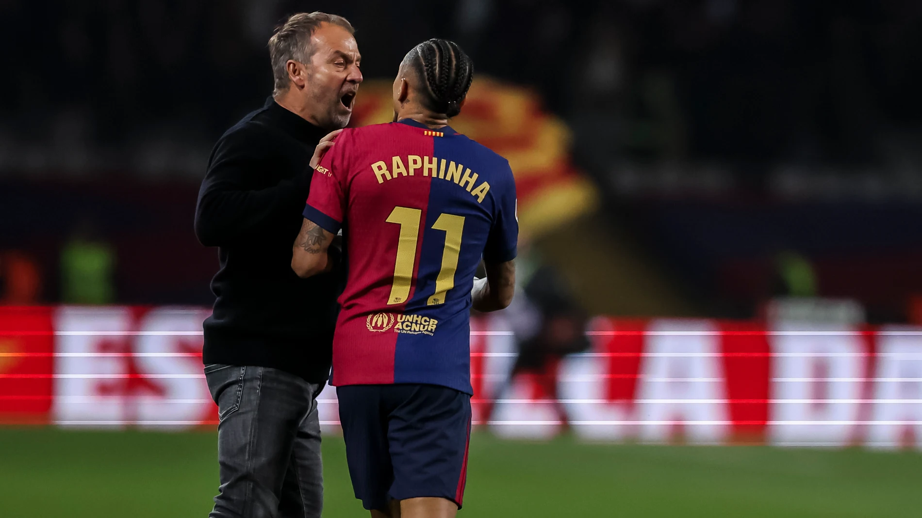 Hansi Flick, head coach of FC Barcelona stops Raphinha Dias Belloli when he was about to protest to the assistant referee at the end of the match, the Spanish league, La Liga EA Sports, football match played between FC Barcelona and Real Betis at Estadi Olimpic Lluis Companys on April 05, 2025 in Barcelona, Spain. AFP7 05/04/2025 ONLY FOR USE IN SPAIN