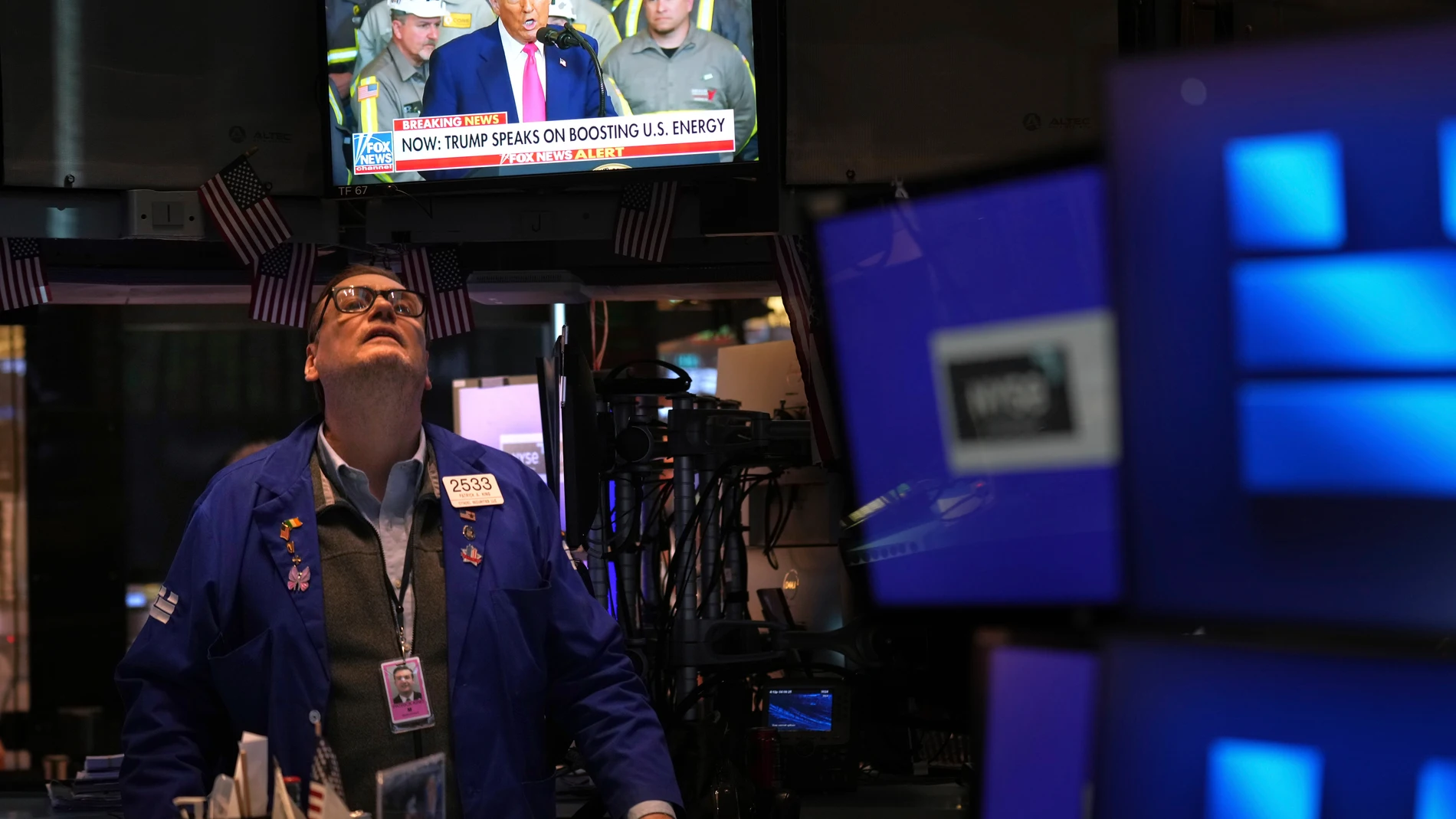 President Donald Trump is displayed on a television on the floor at the New York Stock Exchange in New York, Tuesday, April 8, 2025. (AP Photo/Seth Wenig)