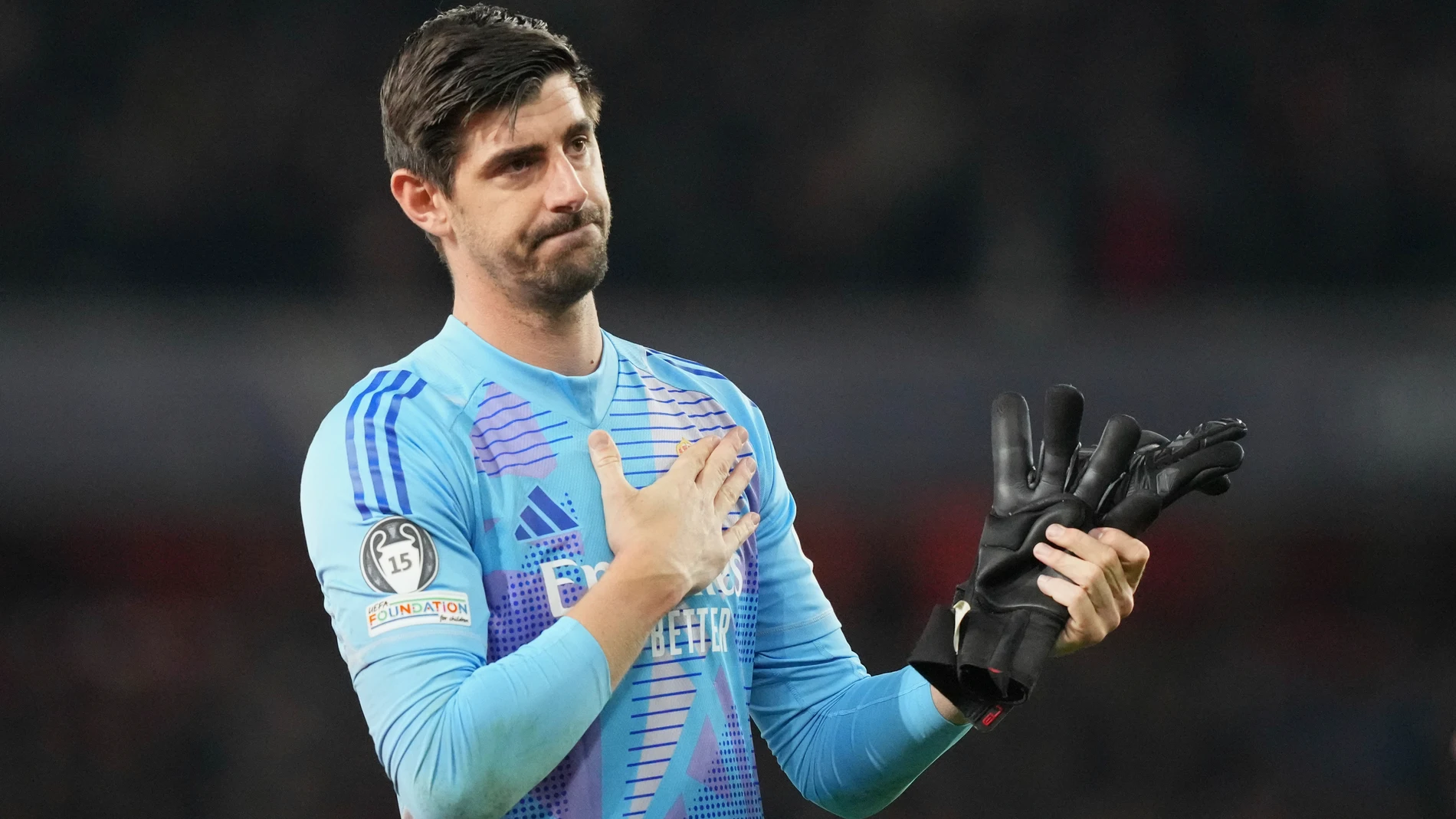 Real Madrid's goalkeeper Thibaut Courtois reacts as he applauds fans at the end of the Champions League quarterfinal first leg soccer match between Arsenal and Real Madrid at the Emirates Stadium in London, Tuesday, April 8, 2025. (AP Photo/Frank Augstein)