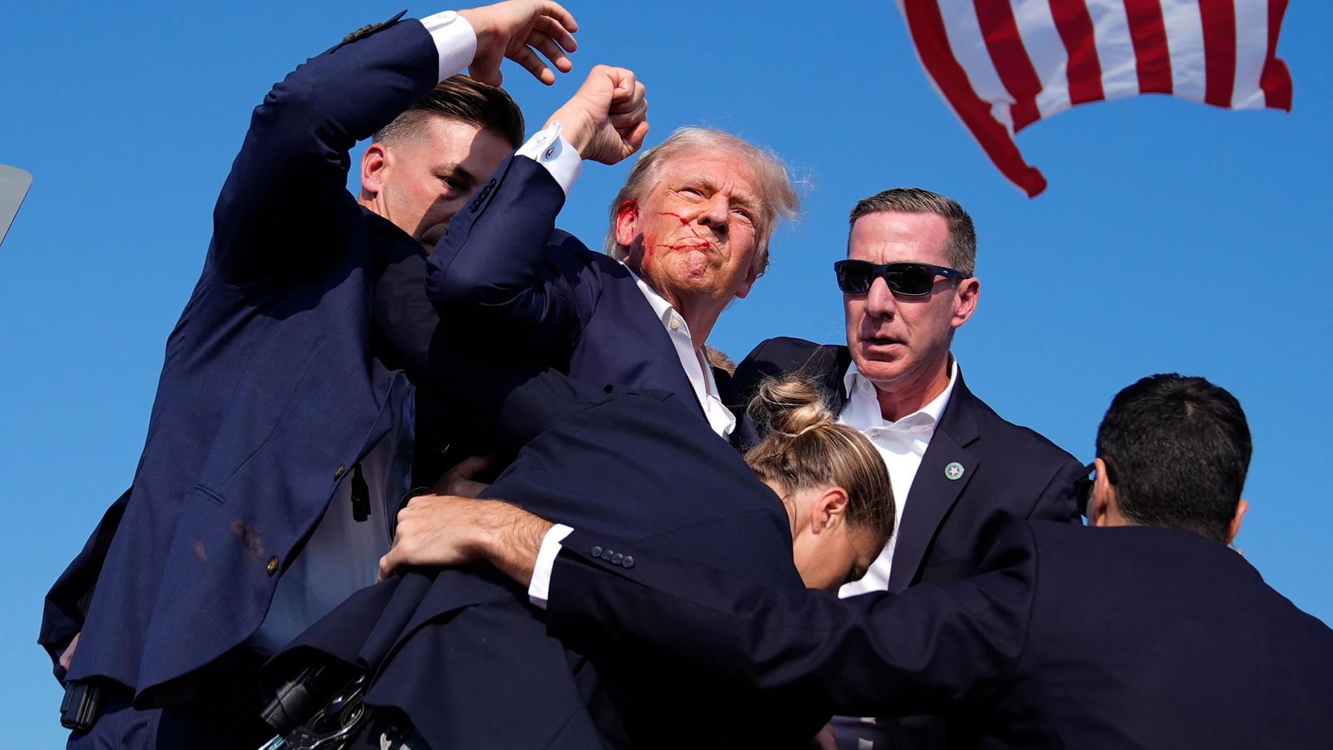 FILE - Republican presidential candidate former President Donald Trump is surrounded by U.S. Secret Service agents at a campaign rally, July 13, 2024, in Butler, Pa. (AP Photo/Evan Vucci, File)