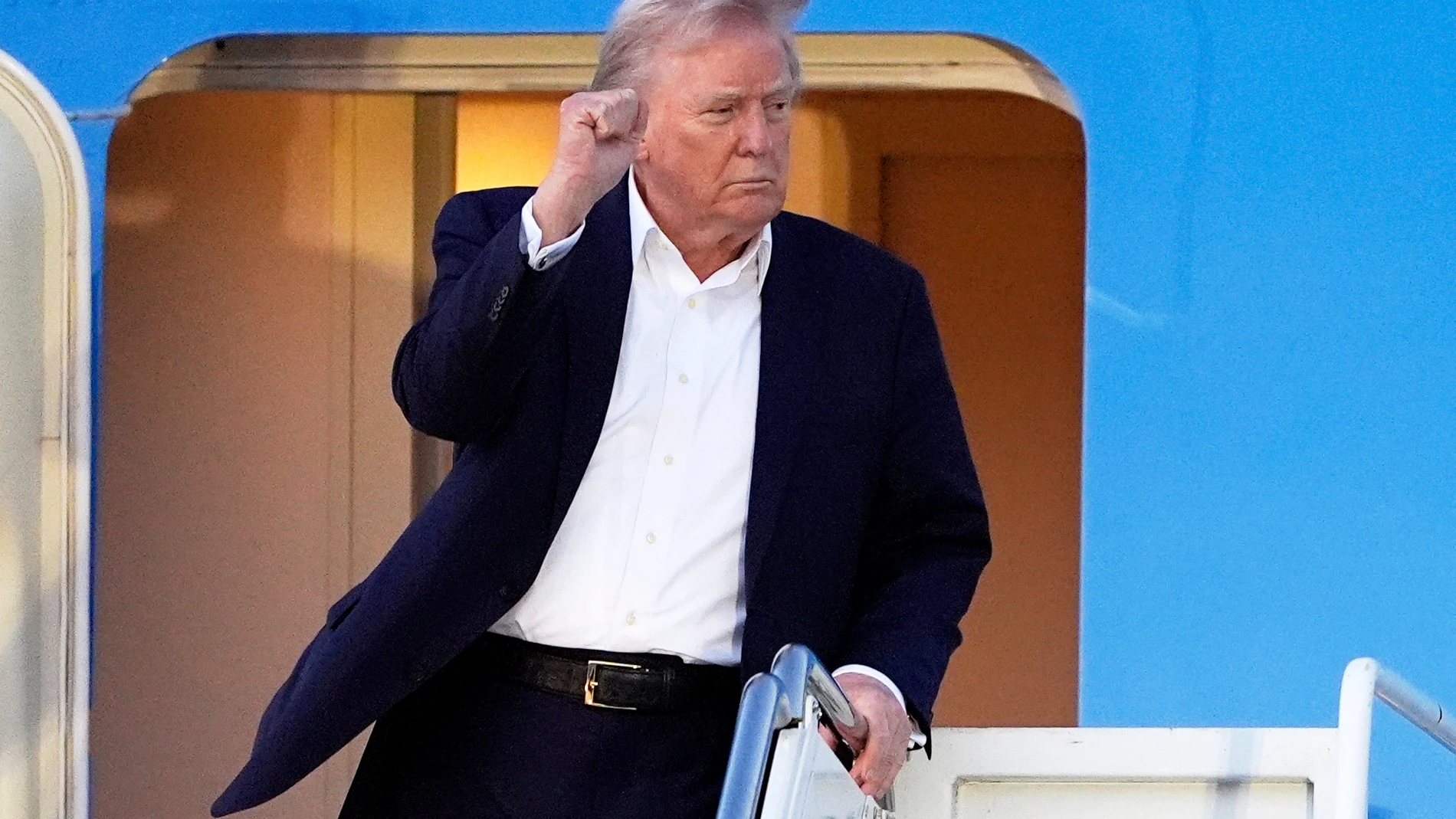President Donald Trump arrives at Palm Beach International Airport, Friday, April 11, 2025, in West Palm Beach, Fla. (AP Photo/Manuel Balce Ceneta)