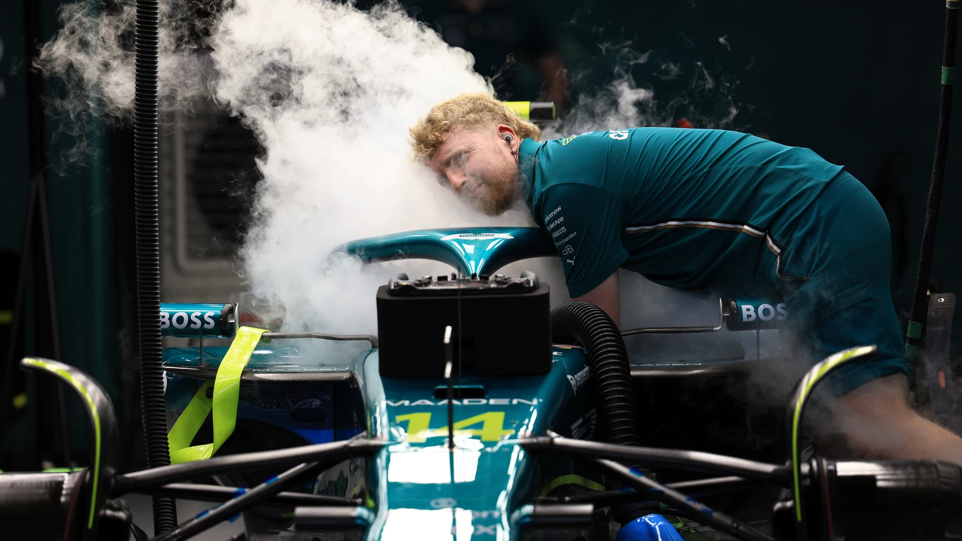 A mechanic works on the Aston Martin driver Fernando Alonso's car during the qualifying session ahead of the Formula One Saudi Arabian Grand Prix at the Jeddah Corniche Circuit in Jeddah, Saudi Arabia, Saturday, April 19, 2025. (Thaier Al-Sudani/Pool Via AP)