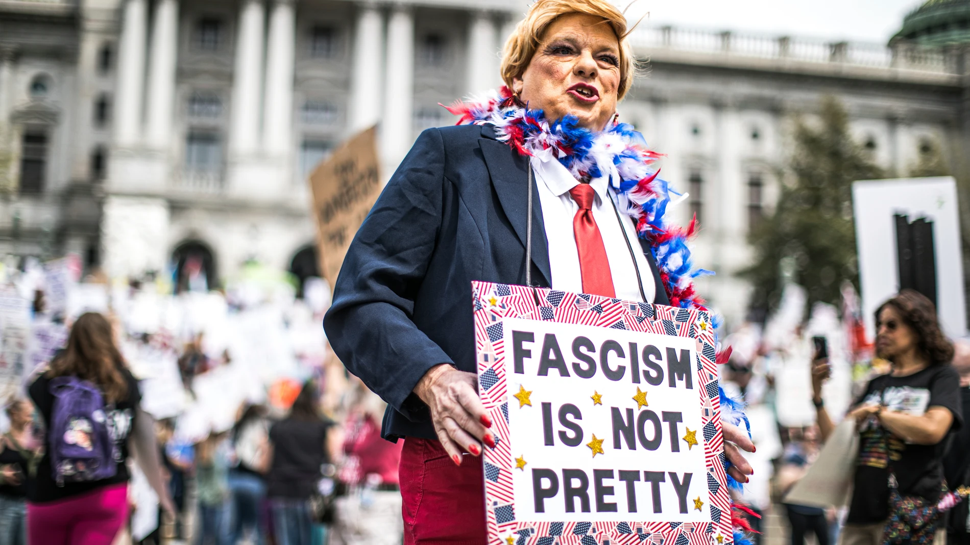 Protesters rally at the state capitol in Harrisburg, Pa., during the Day of Action protest against the Trump Administration. Saturday, April 19, 2025. (Zach Gleiter/The Patriot-News via AP)
