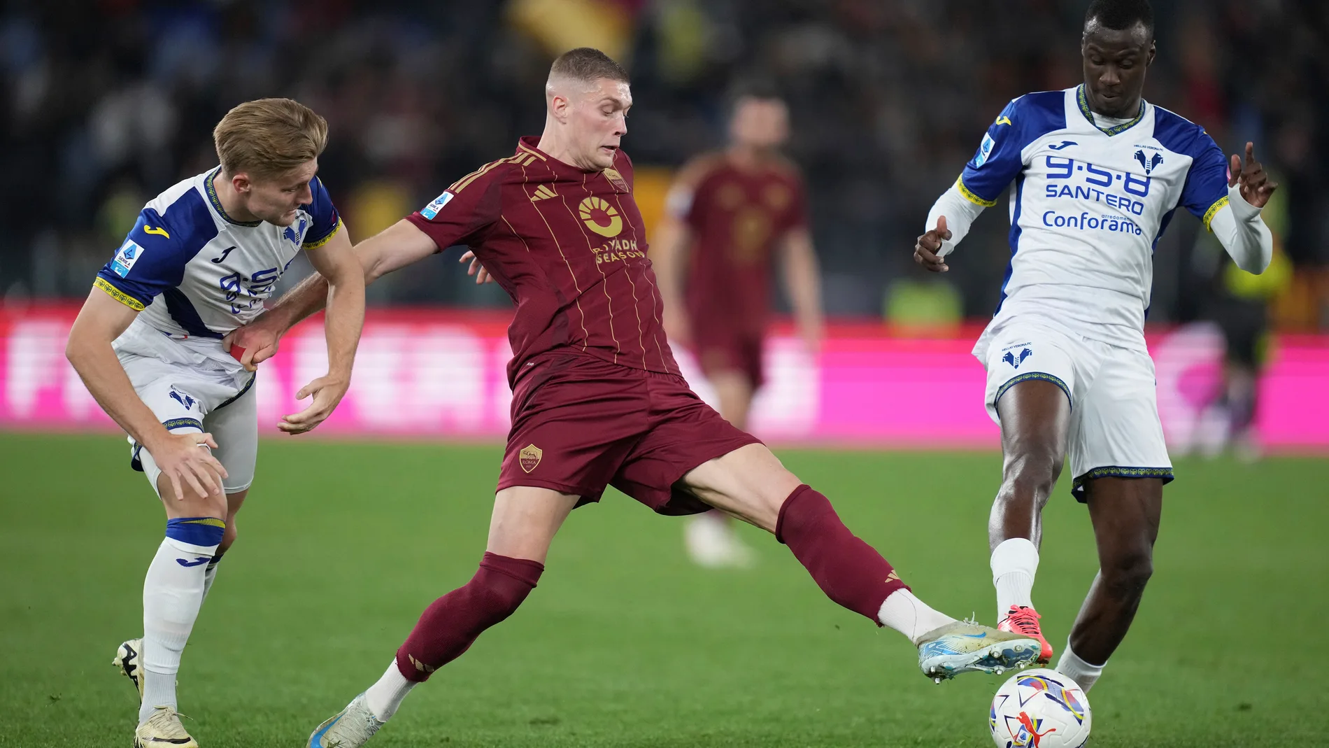 Verona's Martin Frese, Roma's Artem Dovbyk and Verona's Cheikh Niasse in action during the Serie A soccer match between Roma and Hellas Verona at the Rome's Olympic stadium, Italy, Saturday, April 19, 2025. (Alfredo Falcone/LaPresse via AP)
