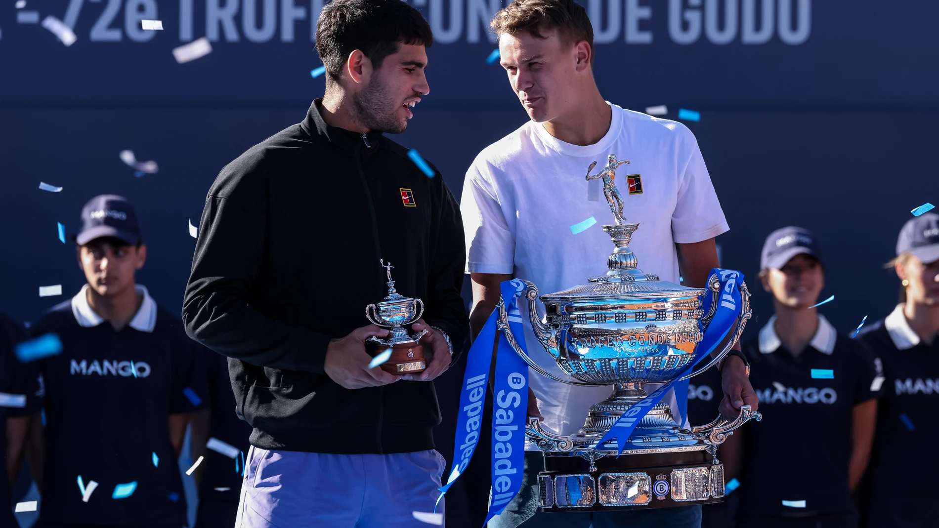 Holger Rune of Denmark and Carlos Alcaraz of Spain hold up their trophies after the Final of the Barcelona Open Banc Sabadell - Conde Godo 2025 Day 7 tennis final at the Real Club De Tenis Barcelona on April 20, 2025 in Barcelona, Spain. AFP7 20/04/2025 ONLY FOR USE IN SPAIN