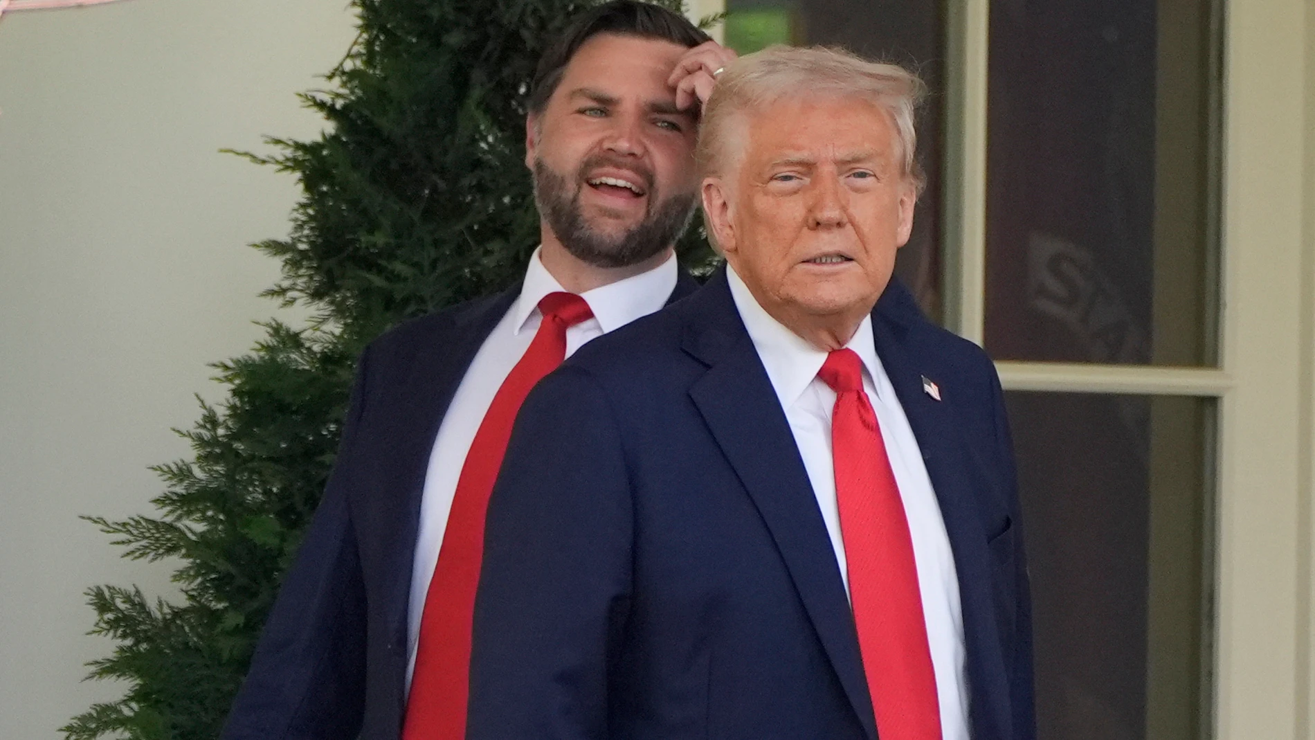 FILE - President Donald Trump and Vice President JD Vance pause near the Oval Office after and event to welcome the 2025 College Football National Champions, the Ohio State University football team on the South Lawn of the White House, April 14, 2025, in Washington. (AP Photo/Alex Brandon, File)