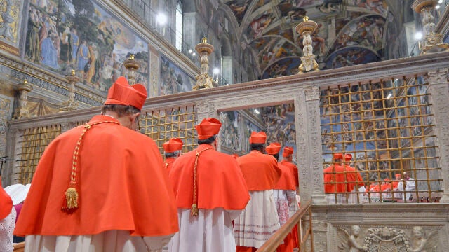 In this picture released by the Vatican newspaper L'Osservatore Romano, Cardinals enter the Sistine Chapel at the Vatican, Tuesday, March 12, 2013, to start the conclave to elect the 266th Roman Catholic pope. Cardinals from around the globe locked themselves inside the Sistine Chapel on Tuesday to choose a new leader for the world's 1.2 billion Catholics and their troubled church, surrounded by Michelangelo's imposing frescos imagining the beginning and the end of the world. 