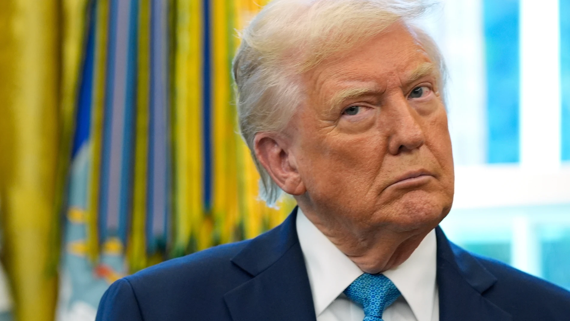 President Donald Trump listens during a ceremonial swearing in of Paul Atkins as chairman of the Securities and Exchange Commission, in the Oval Office of the White House, Tuesday, April 22, 2025, in Washington. (AP Photo/Alex Brandon)