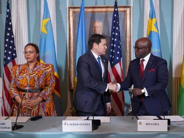 United States Congo Rwanda Secretary of State Marco Rubio hosts a Declaration of Principles signing ceremony with Congo's Foreign Minister Therese Kayikwamba Wagner, left, and Rwanda's Foreign Minister Olivier Nduhungirehe, right, Friday, April 25, 2025, at the State Department in Washington. (AP Photo/Jacquelyn Martin)