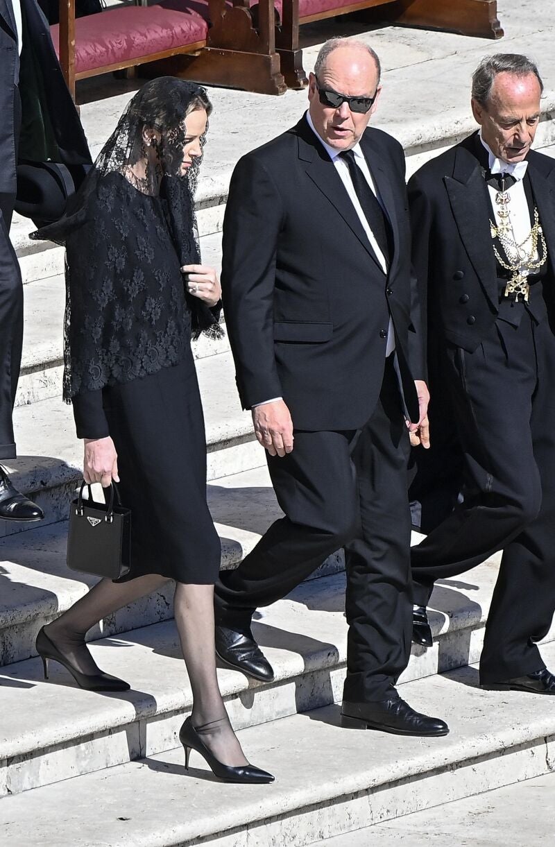 Prince Albert II of Monaco (C) with his wife Charlene arrive for the funeral Mass of Pope Francis in Saint Peter's Square in Vatican City, 26 April 2025. 