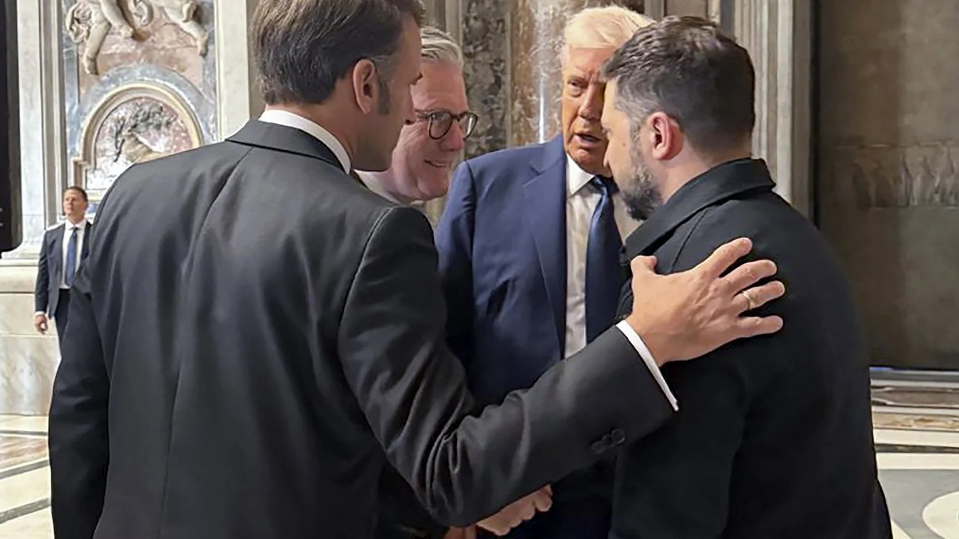 A handout photo made available by the Ukrainian Presidential Press Service shows (L-R) French President Emmanuel Macron, British Prime Minister Keir Starmer, US President Donald J. Trump, and Ukrainian President Volodymyr Zelensky speaking in Saint Peter's Cathedral prior to the funeral Mass of Pope Francis in Saint Peter's Square in Vatican City, 26 April 2025.
