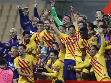 Barcelona players hold the trophy as they celebrate after winning the Spanish Copa del Rey final 2021 against Athletic Bilbao at La Cartuja stadium in Seville, Spain, Saturday April 17, 2021. (AP Photo/Angel Fernandez) Barcelona players hold the trophy as they celebrate after winning the Spanish Copa del Rey final 2021 against Athletic Bilbao at La Cartuja stadium in Seville, Spain, Saturday April 17, 2021. (AP Photo/Angel Fernandez)