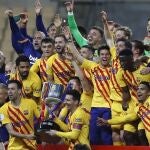 Barcelona players hold the trophy as they celebrate after winning the Spanish Copa del Rey final 2021 against Athletic Bilbao at La Cartuja stadium in Seville, Spain, Saturday April 17, 2021. (AP Photo/Angel Fernandez)
