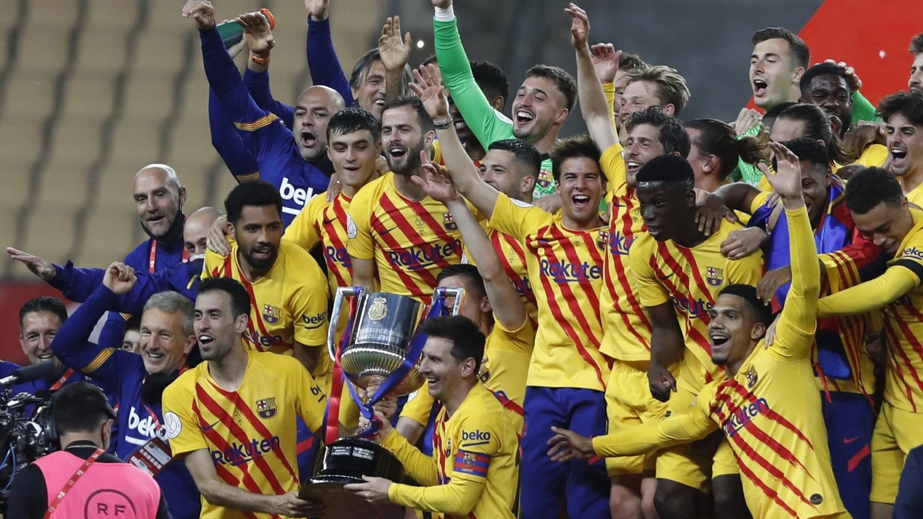 Barcelona players hold the trophy as they celebrate after winning the Spanish Copa del Rey final 2021 against Athletic Bilbao at La Cartuja stadium in Seville, Spain, Saturday April 17, 2021. (AP Photo/Angel Fernandez)