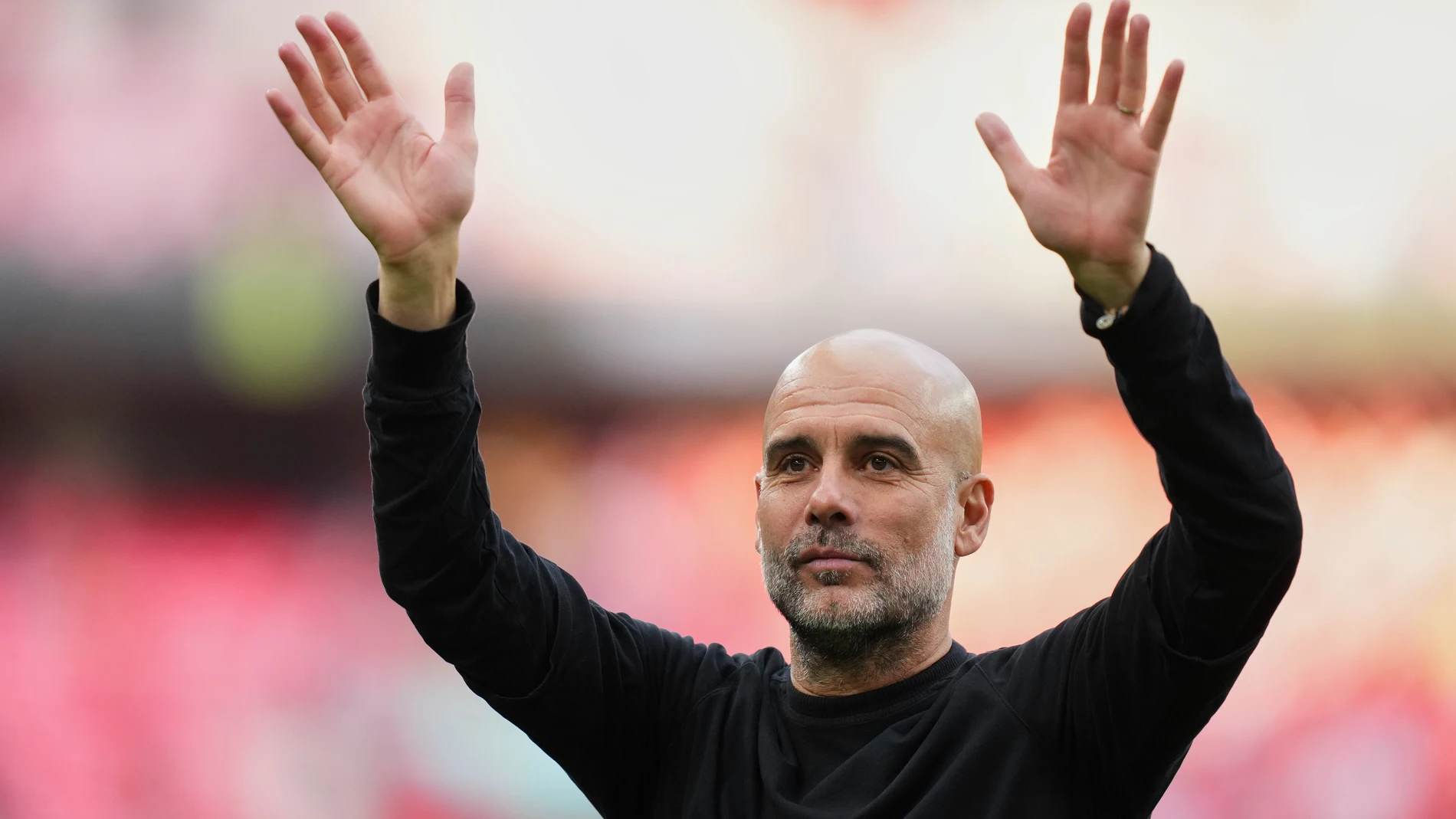 Manchester City's head coach Pep Guardiola waves to the fans after the English FA Cup semifinal soccer match between Nottingham Forest and Manchester City at Wembley stadium in London, Sunday, April 27, 2025. (AP Photo/Kirsty Wigglesworth)