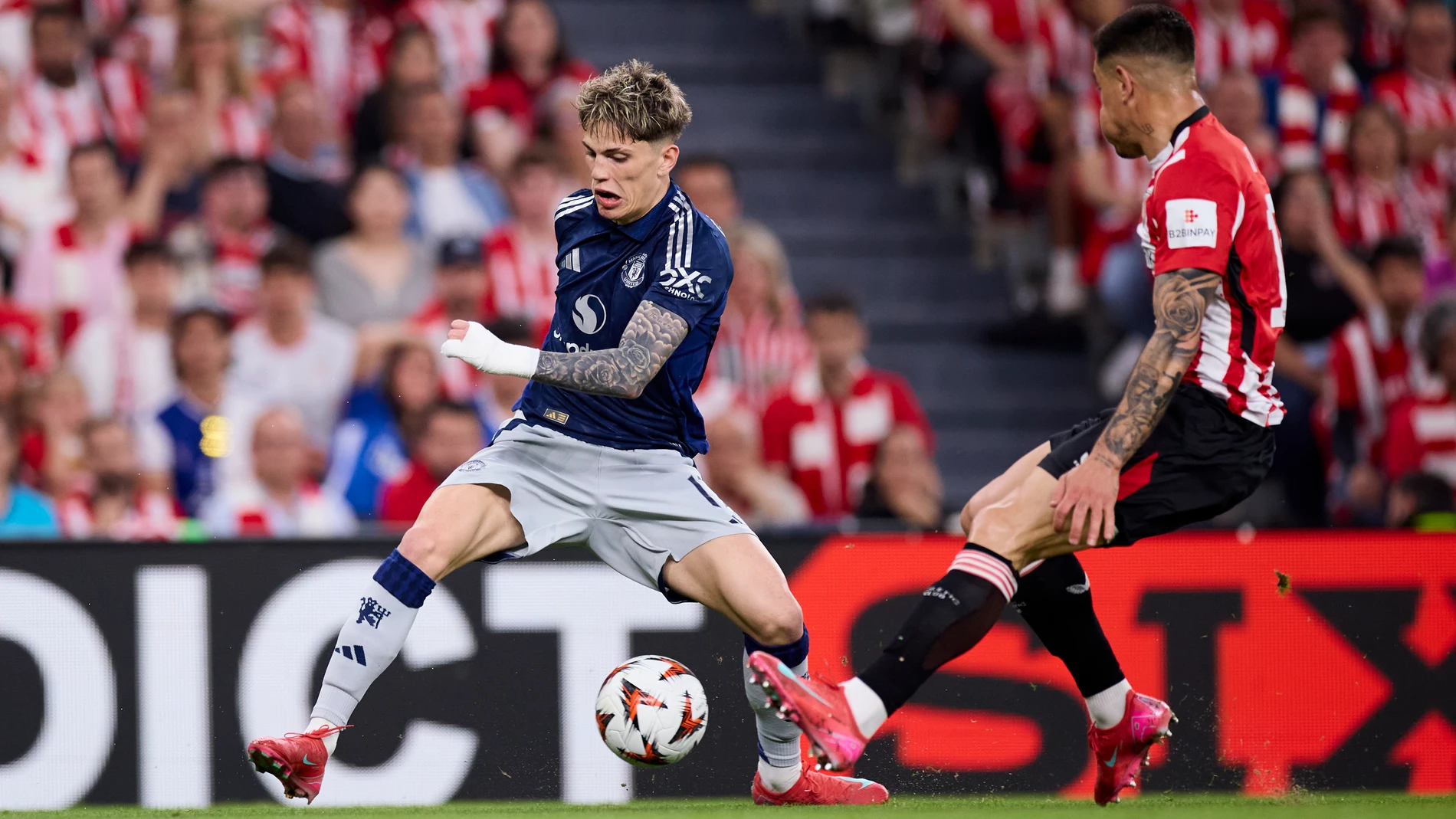 Alejandro Garnacho of Manchester United competes for the ball with Yuri Berchiche of Athletic Club during the UEFA Europa League 2024/25 Semi Final First Leg match between Athletic Club and Manchester United at San Mames on May 1, 2025, in Bilbao, Spain. AFP7 01/05/2025 ONLY FOR USE IN SPAIN