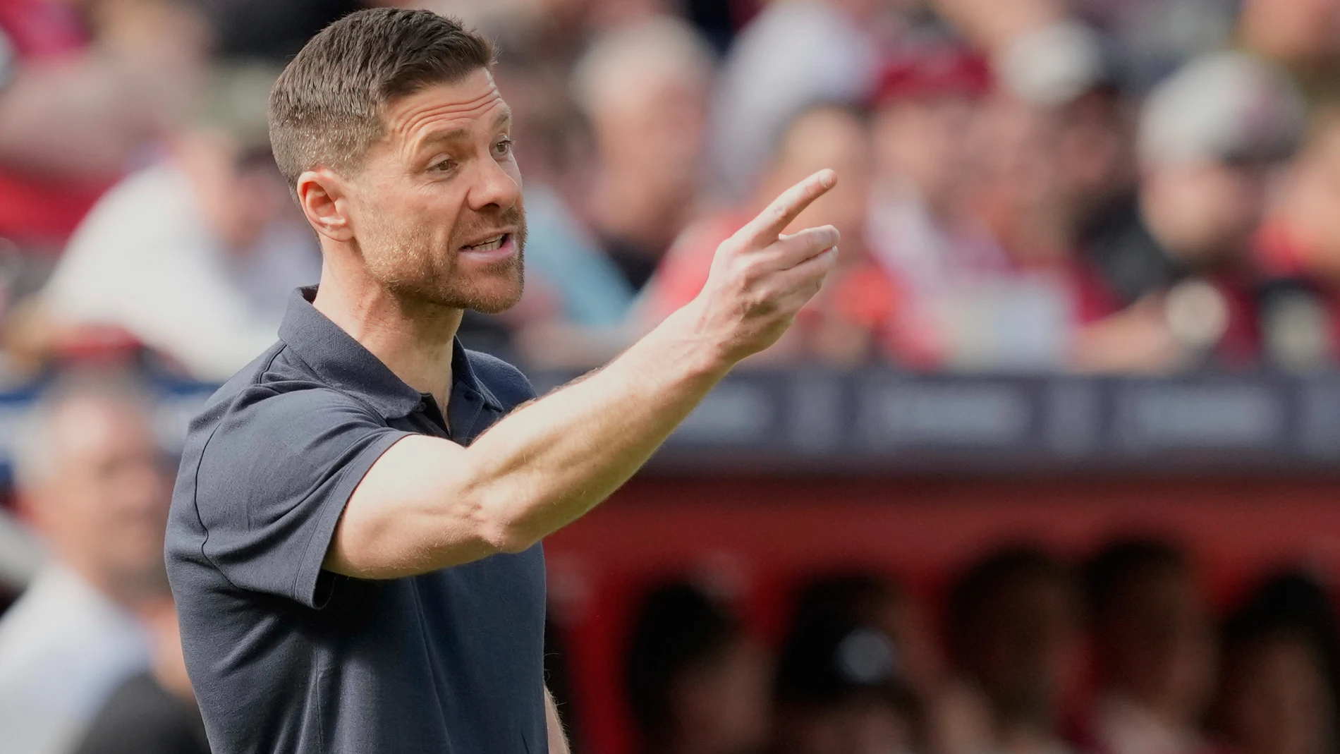 FILE - Leverkusen's head coach Xabi Alonso gives instructions from the side line during the German Bundesliga soccer match between Bayer Leverkusen and Union Berlin at the BayArena in Leverkusen, Germany, on April 12, 2025. (AP Photo/Martin Meissner, File)