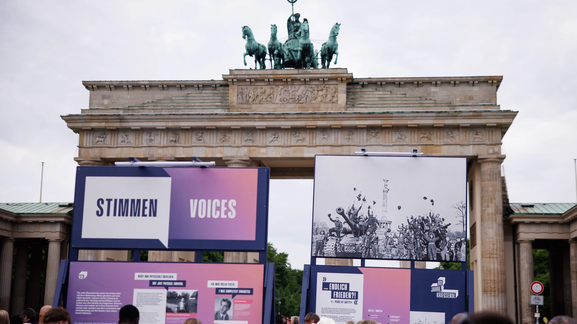 Berlin (Germany), 03/05/2025.- Onlookers stand around information panels and historic photos in front of the Brandenburg Gate in Berlin, Germany, 03 May 2025. From 02 till 11 May, photos and information panels are featured as part of the theme week commemorating '80 years since the end of the war - Europe's liberation from National Socialism'. (Alemania) EFE/EPA/CLEMENS BILAN