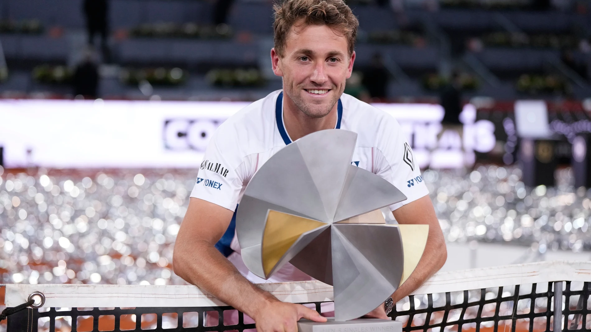 Norway's Casper Ruud holds the trophy after winning the Madrid Open tennis final in Madrid, Spain, Sunday, May 4, 2025. (AP Photo/Manu Fernandez)