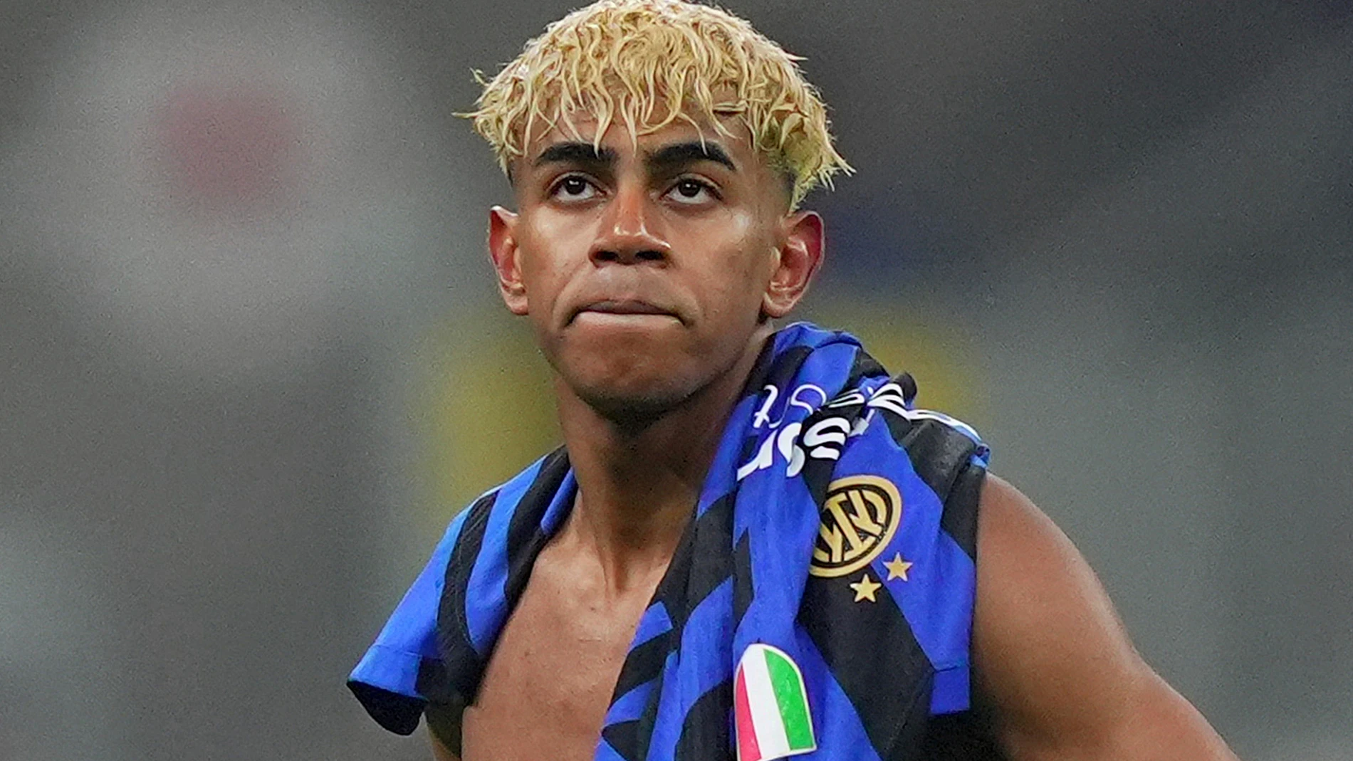 Barcelona's Lamine Yamal stands dejected after the Champions League semifinal second leg soccer match between Inter Milan and Barcelona at San Siro stadium in Milan , Italy, Tuesday, May 6, 2025. (Spada/LaPresse via AP)
