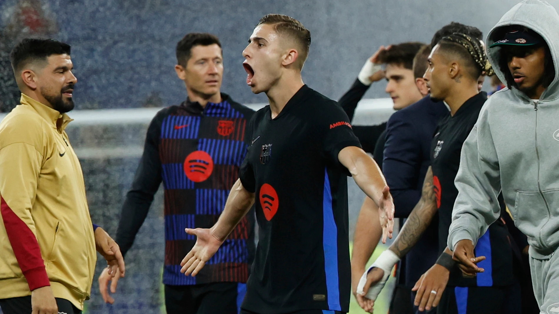 Barcelona's Fermin Lopez celebrates at the end of the Spanish La Liga soccer match between Barcelona and Espanyol at Lluis Companys Olympic Stadium in Barcelona, Spain, Thursday, May 15, 2025. (AP Photo/Joan Monfort)