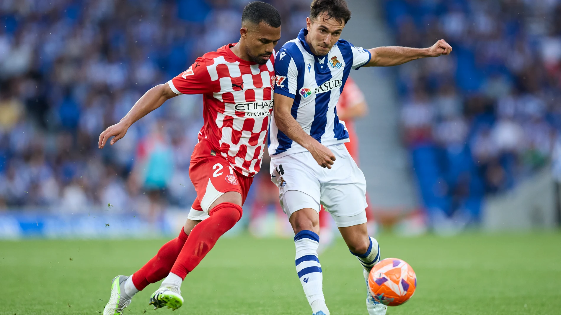 Yangel Herrera of Girona FC competes for the ball with Martin Zubimendi of Real Sociedad during the LaLiga EA Sports match between Real Sociedad and Girona FC at Reale Arena on May 18, 2025, in San Sebastian, Spain. AFP7 18/05/2025 ONLY FOR USE IN SPAIN
