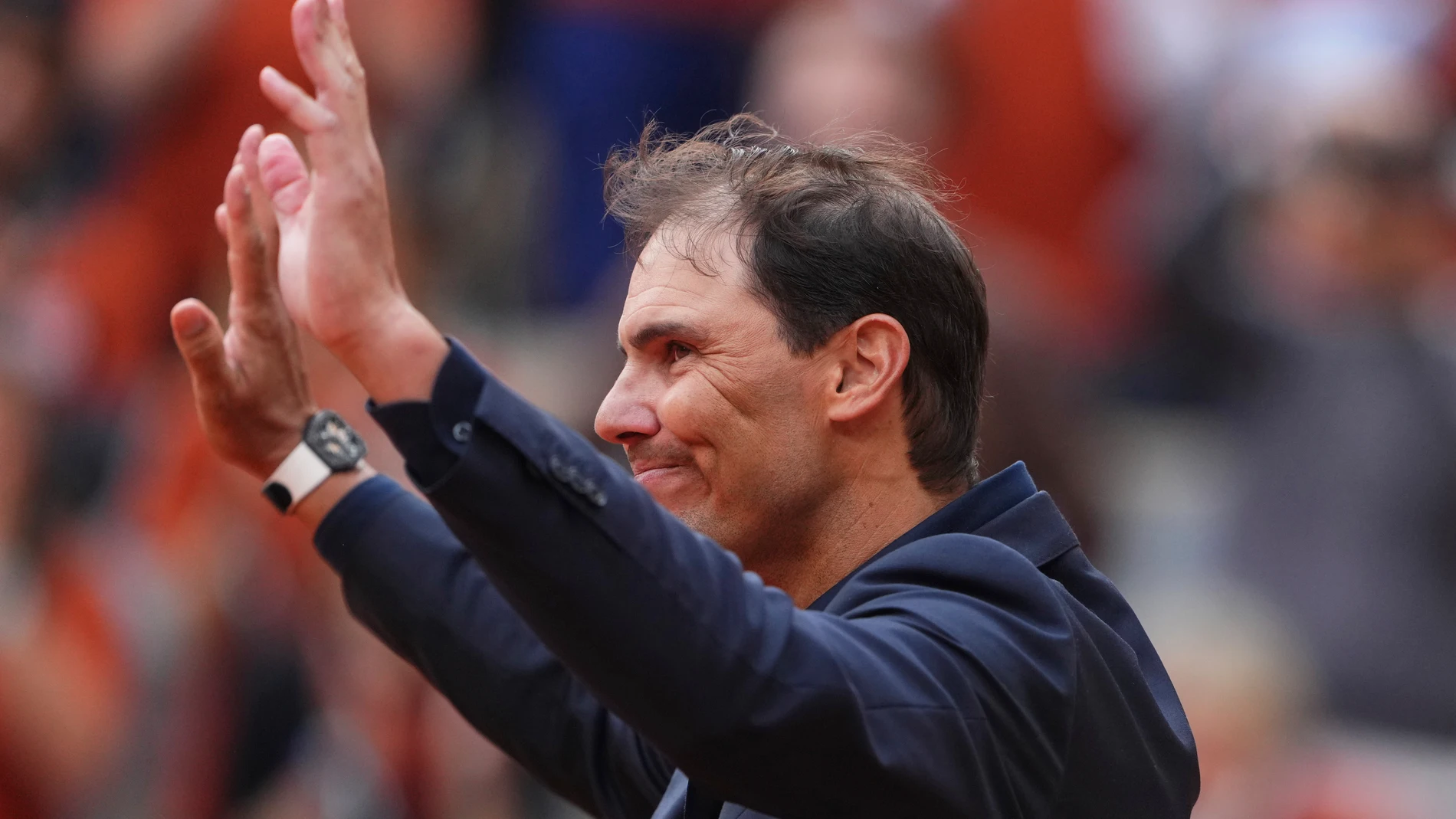 Rafa Nadal is cheered by the crowd during a farewell ceremony at center court Philippe-Chatrier, at the Roland-Garros stadium, in Paris, Sunday May 25, 2025. (AP Photo/Lindsey Wasson)