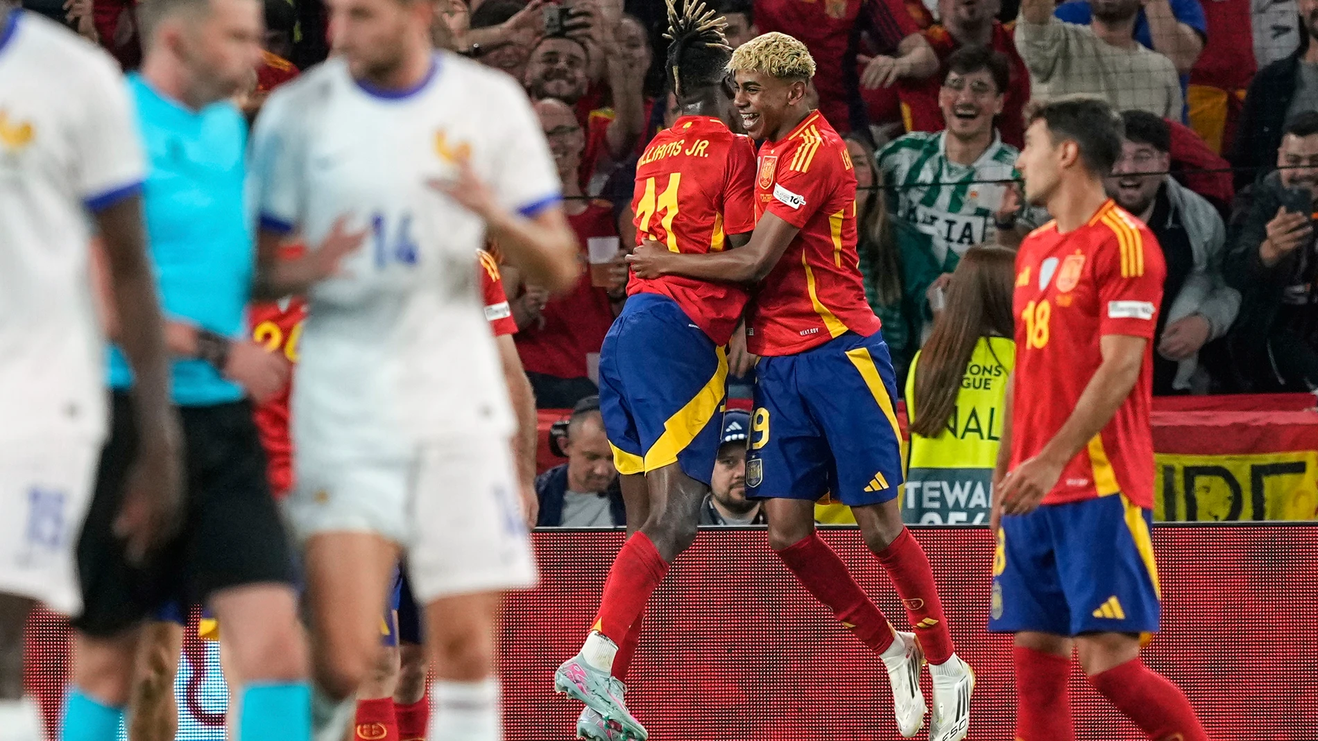 Spain's Lamine Yamal celebrates with Spain's Nico Williams, left, after scoring his side's third goal against France during the Nations League semifinal soccer match between Spain and France at the MHPArena, in Stuttgart, Germany, Thursday, June 5, 2025. (AP Photo/Martin Meissner)