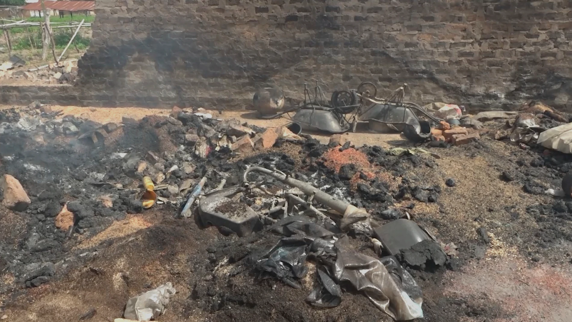 In this screengrab made from video, a burned house following an attack by gunmen in Yelewata community north-central Nigeria, Monday, June 16, 2025. (AP Video)