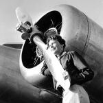 Aviator Amelia Earhart with her Electra plane's propeller, taken by Albert Bresnik at Burbank Airport in Burbank, Calif. It was a clear spring day in 1937 