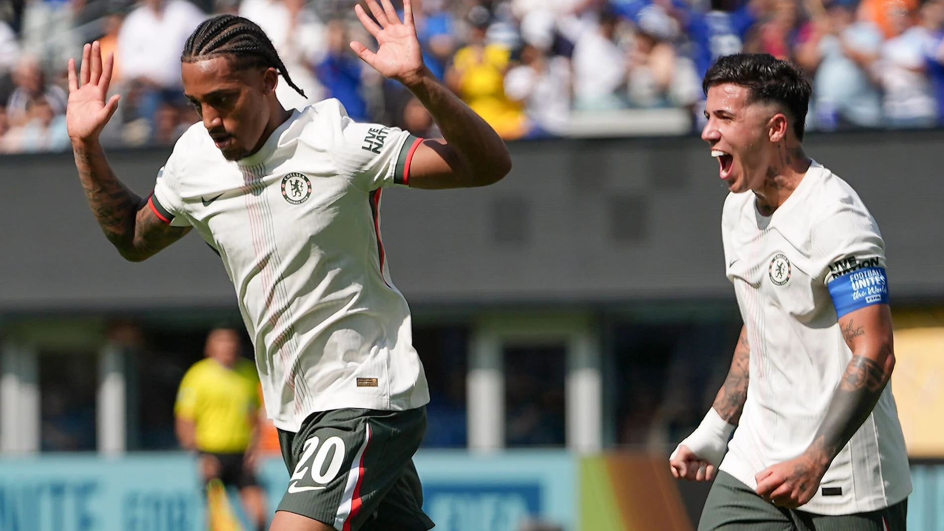 Chelsea's Joao Pedro, left, and Chelsea's Enzo Fernandez celebrate after Pedro scored a goal against Fluminense during the second half of a Club World Cup semifinal soccer match in East Rutherford, N.J., Tuesday, July 8, 2025. (AP Photo/Frank Franklin II)