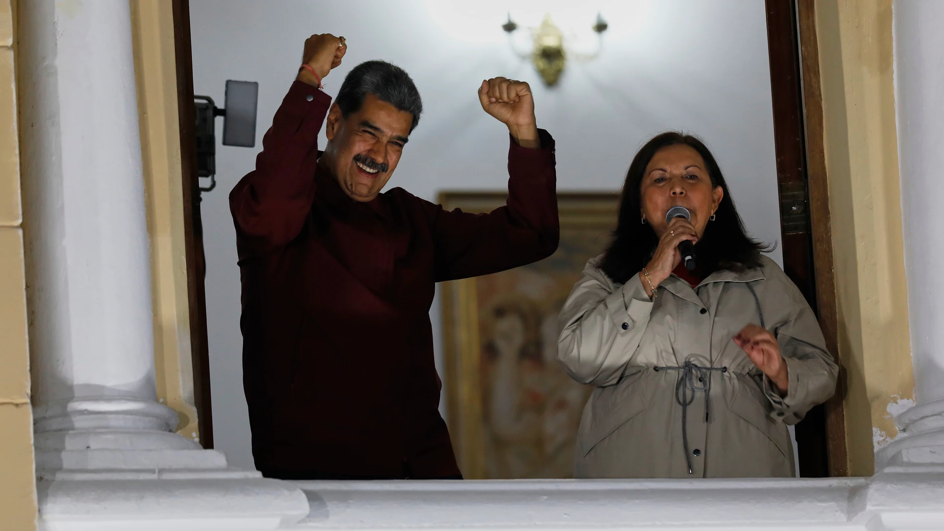 Venezuela's President Nicolas Maduro celebrates as Caracas mayor-elect Adm. Carmen Melendez speaks to supporters after municipal elections in Caracas, Venezuela, Monday, July 28, 2025.(AP Photo/Cristian Hernandez)