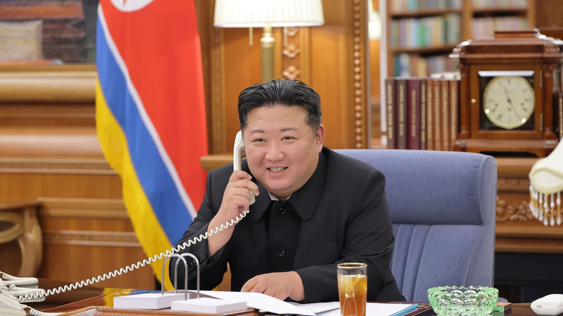 In this photo provided by the North Korean government, its leader Kim Jong Un speaks with Russian President Vladimir Putin on the phone at an undisclosed location in North Korea, Tuesday, Aug. 12, 2025. Independent journalists were not given access to cover the event depicted in this image distributed by the North Korean government. The content of this image is as provided and cannot be independently verified. Korean language watermark on image as provided by source reads: "KCNA" which is the...