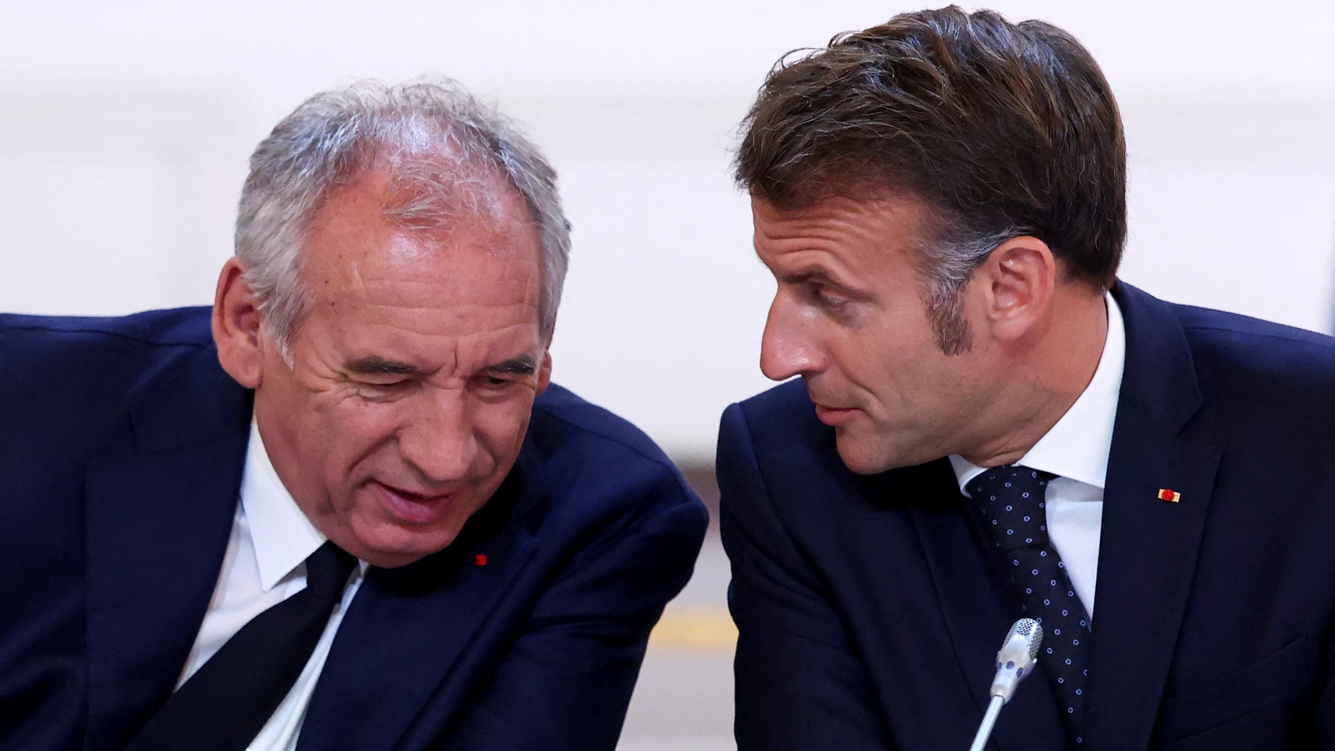 FILE -French President Emmanuel Macron, left, and Prime Minister Francois Bayrou attend a meeting with New Caledonia's elected officials and state representatives who have concluded a historic agreement allowing the creation of a "State of New Caledonia" within the French Republic, at the Elysee Palace in Paris, July 12, 2025. (Tom Nicholson, Pool Photo via AP, File)