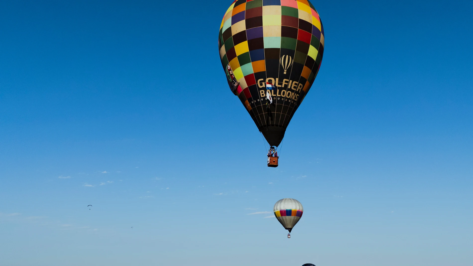Hot air balloons sail in the sky during a World Ballooning Championships race in Colonia Yguazu, Paraguay, Friday, Aug. 29, 2025. (AP Photo/Jorge Saenz)