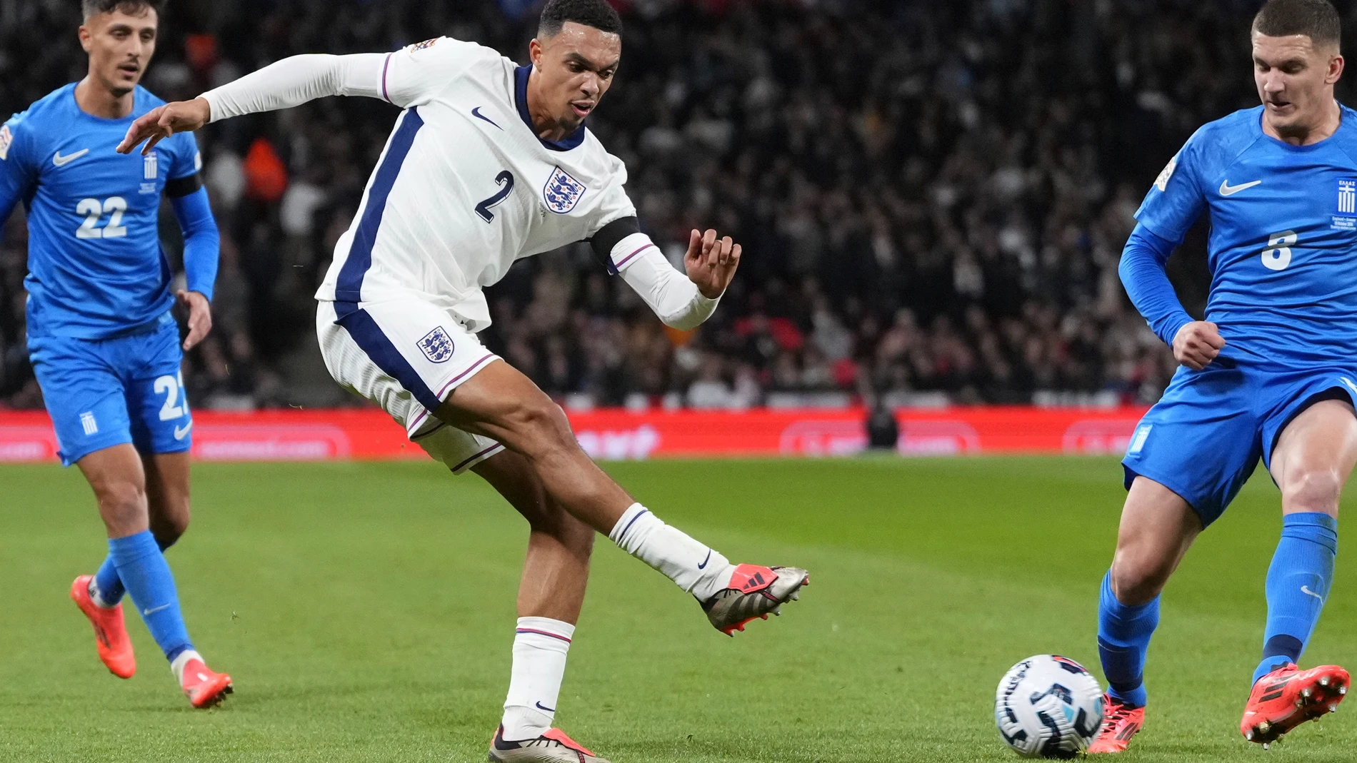 FILE - England's Trent Alexander-Arnold, centre, shoots the ball during the UEFA Nations League Group F soccer match between England and Greece at Wembley Stadium in London, on Oct. 10, 2024. (AP Photo/Kirsty Wigglesworth, File)