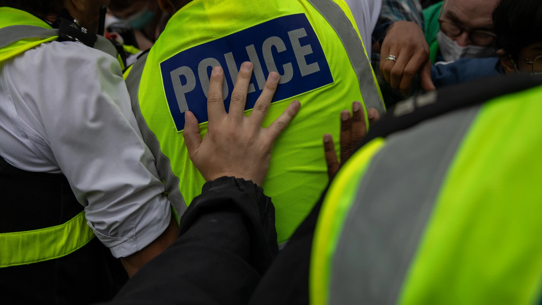 August 2, 2025, London, Islington, United Kingdom: A Metropolitan Police officer pushes a colleague during the demonstration. Residents protested under the banner â€?Thistle Barbican needs to go locals say noâ€. Right-wing groups and â€?Stand up to Racism†held counter-protests outside the hotel, with police ensuring separation. The demonstration was in response to reported crimes by hotel residents and ongoing tensions over migrant accommodation. Early in the afternoon, a group identified a...
