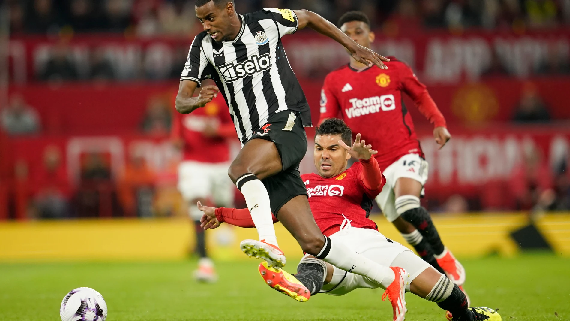 FILE - Newcastle's Alexander Isak, center, challenges for the ball with Manchester United's Casemiro during the English Premier League soccer match between Manchester United and Newcastle United, in Manchester, England, Wednesday, May 15, 2024. (AP Photo/Dave Thompson, File)