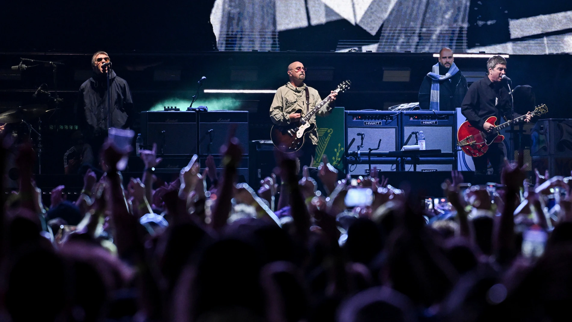 Liam Gallagher, from left, Paul Arthurs and Noel Gallagher of Oasis perform on Sunday, Aug. 31, 2025, at MetLife Stadium in East Rutherford, New Jersey. (Photo by Evan Agostini/Invision/AP)