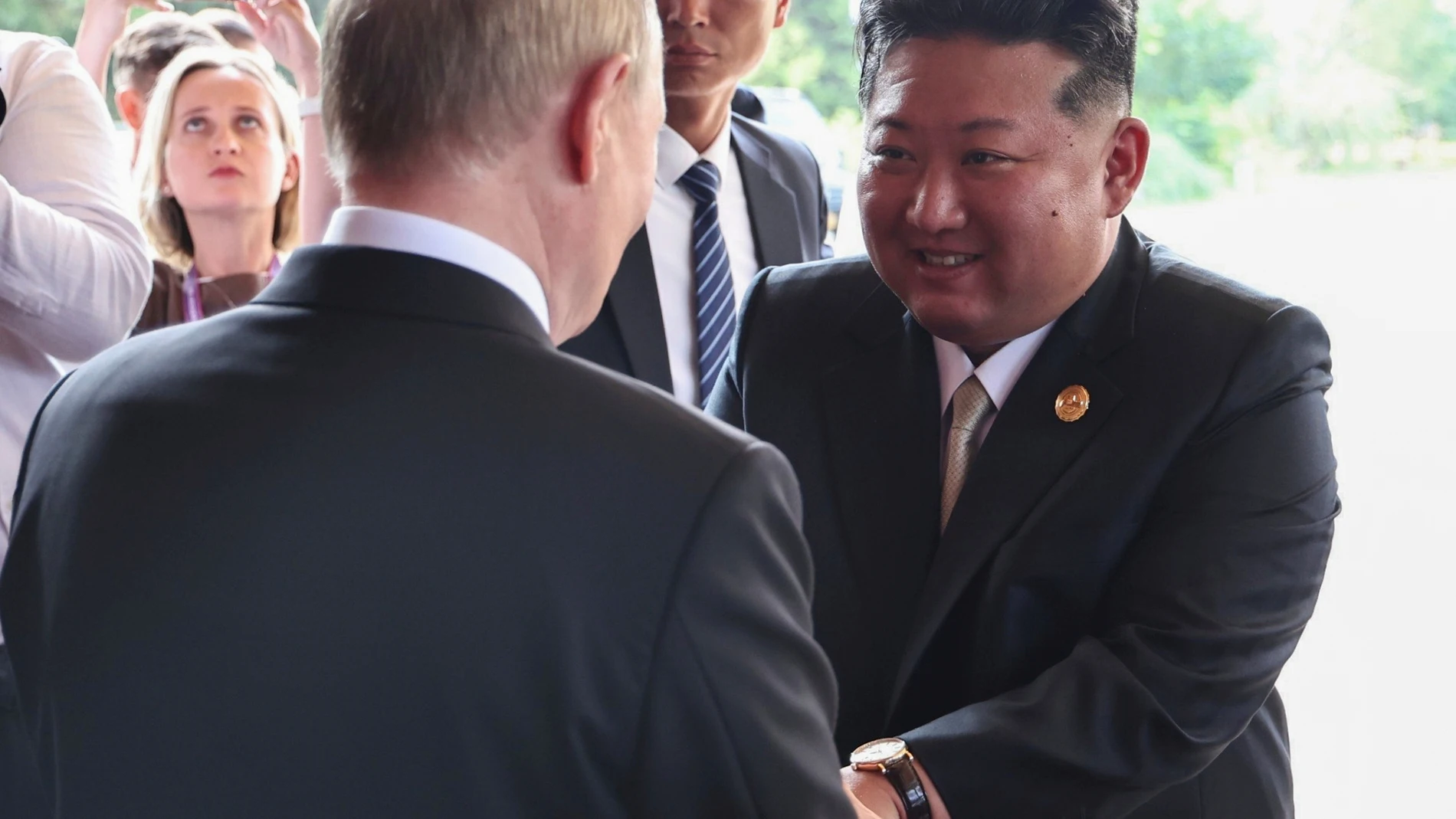 Russian President Vladimir Putin, back to camera, and North Korean leader Kim Jong Un shake hands after their meeting at Diaoyutai State Guesthouse in Beijing, China, Wednesday, Sept. 3, 2025. (Alexander Kazakov, Sputnik, Kremlin Pool Photo via AP)
