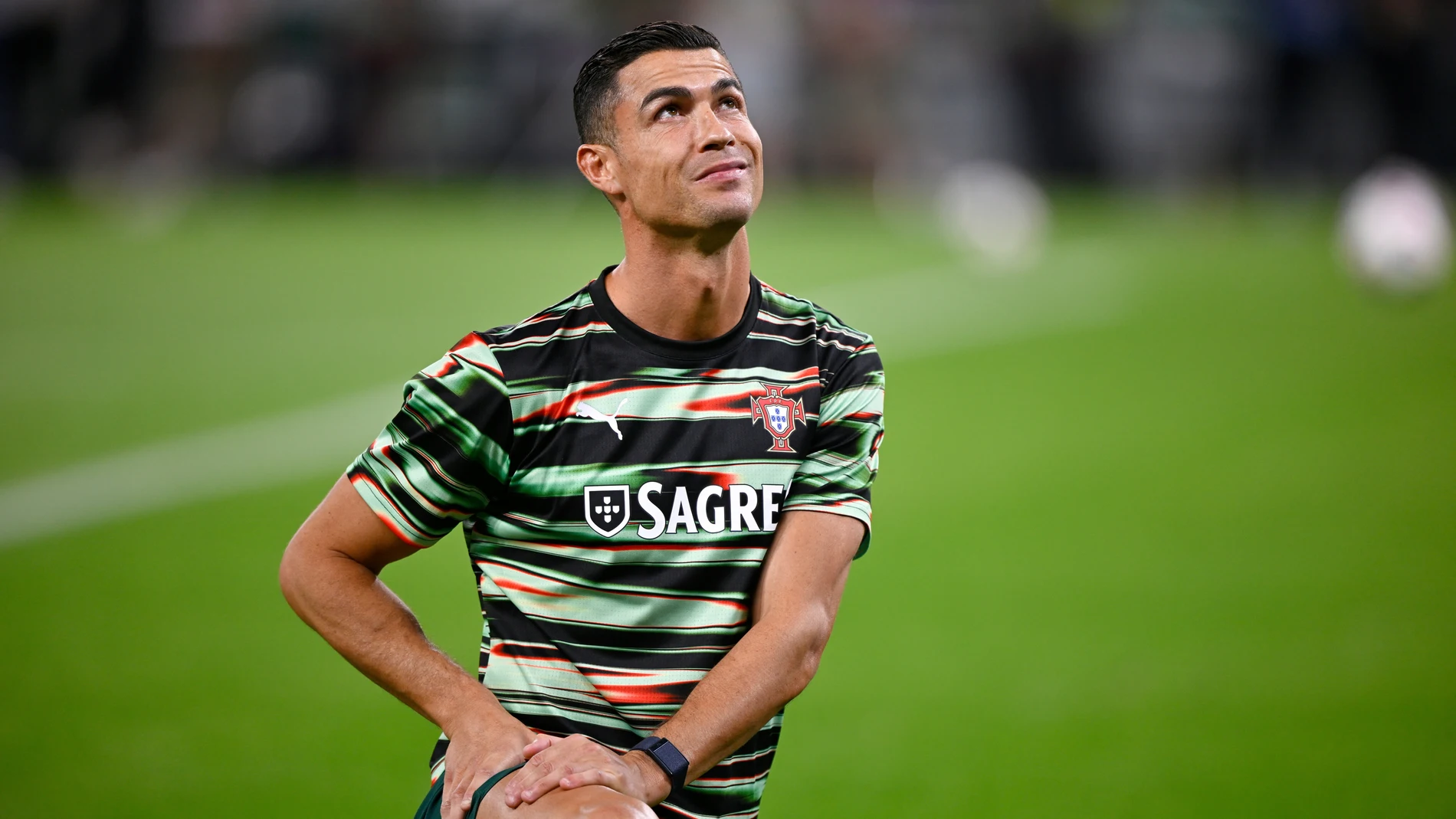 Portugal's Cristiano Ronaldo stretches during warmup before a World Cup 2026 group F qualifying soccer match between Hungary and Portugal at the Puskas Arena in Budapest, Tuesday, Sept. 9, 2025. (AP Photo/Denes Erdos)