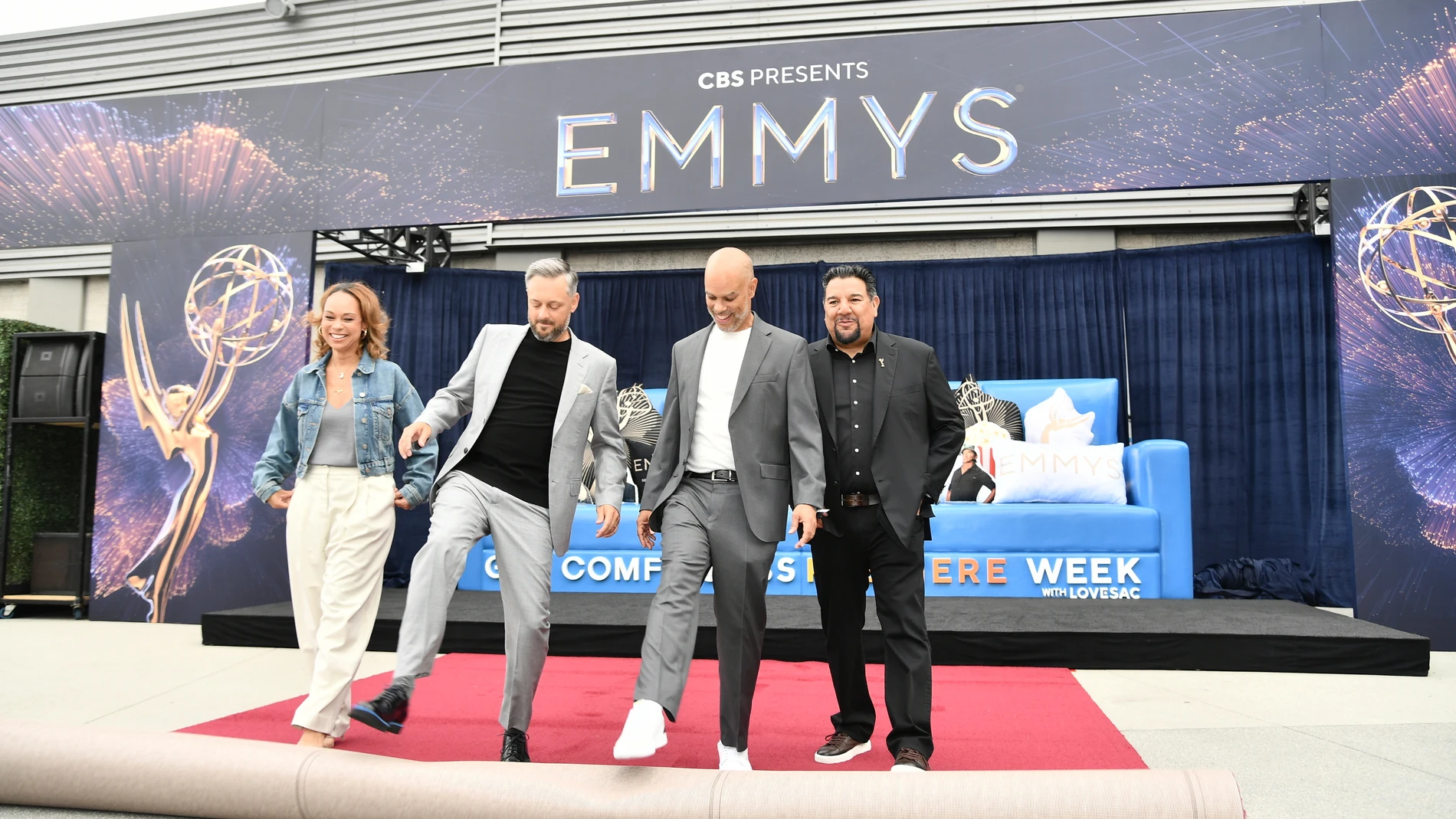 Jeannae Rouzan-Clay, from left, Nate Bartgatze, Jesse Collins and Cris Abrego roll out the red carpet for the 77th Primetime Emmy Awards on Thursday, Sept. 11, 2025, in Los Angeles. (Photo by Richard Shotwell/Invision/AP)