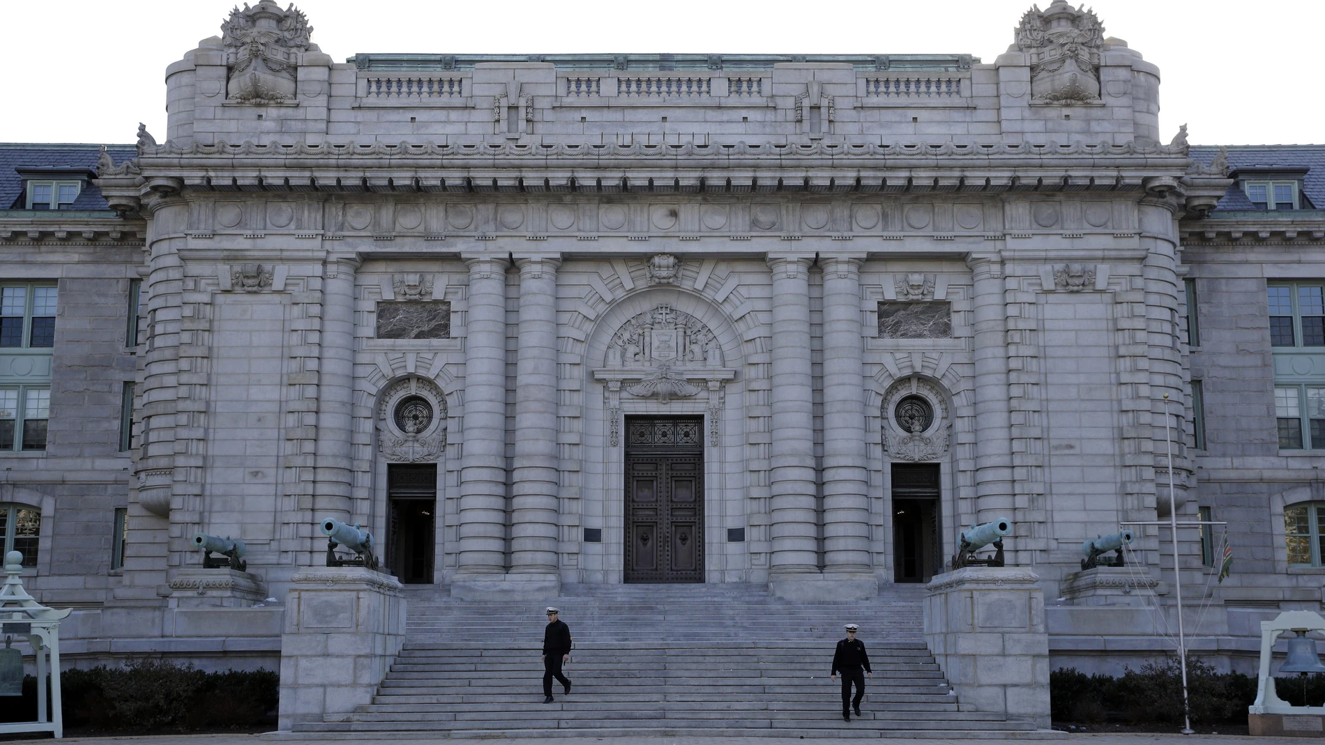 FILE - Midshipmen walk down the front steps of Bancroft Hall, the main dormitory on the U.S. Naval Academy campus in Annapolis, Md., Jan. 9, 2014. (AP Photo/Patrick Semansky, File)