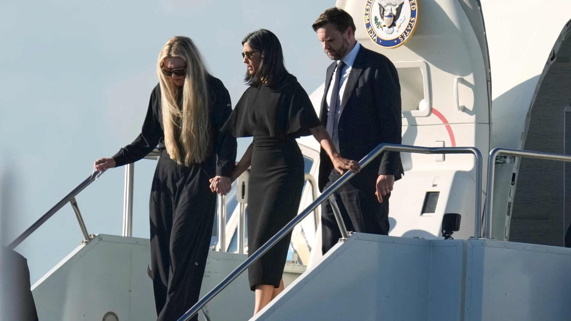 Vice President JD Vance, right, Second Lady Usha Vance, center, and Erika Kirk deplane Air Force Two, carrying the body of Charlie Kirk, the CEO and co-founder of Turning Point USA, Thursday, Sept. 11, 2025, in Phoenix, who was shot and killed on Wednesday. AP Photo/(Ross D. Franklin)