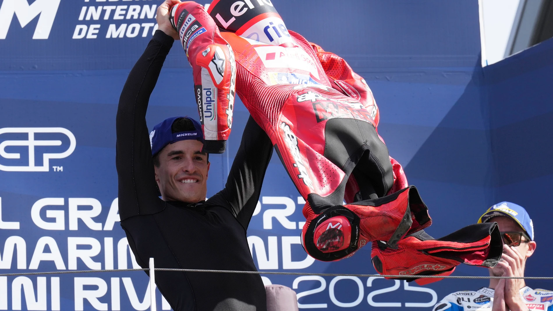 Spain's rider Marc Marquez of the Ducati Lenovo Team celebrates his victory after the MotoGP race of the San Marino and the Rimini Riviera Grand Prix, at the Misano circuit in Misano Adriatico, Italy, Sunday, Sept. 14, 2025. (AP Photo/Antonio Calanni)